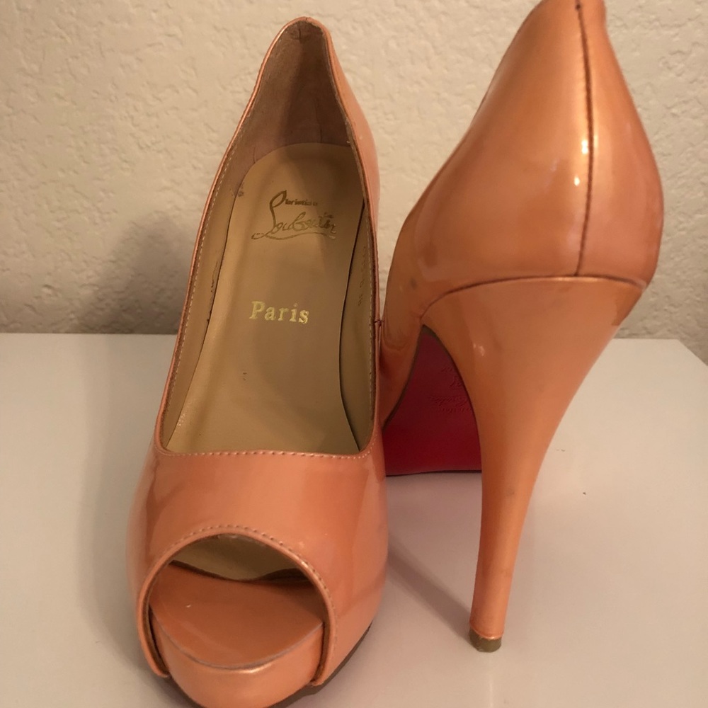 Louboutins peach color pumps